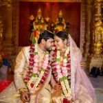 Couple in traditional attire at a Hindu wedding ceremony in Hyderabad.